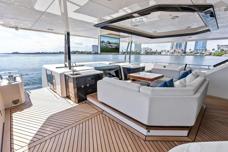 Slide: The Image of Luxurious 2024 Ocean Alexander 35 Revolution yacht deck with elegant seating and scenic waterfront view. - 10