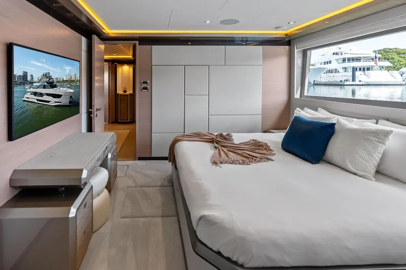 Slide: The Image of Luxurious bedroom interior of 2024 Ocean Alexander 35 Revolution yacht with modern decor and large window view. - 51