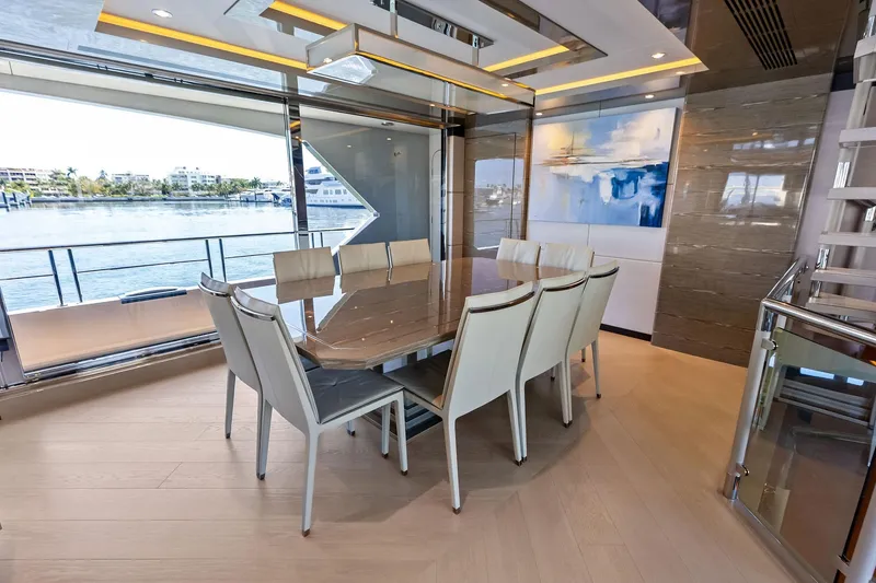 Slide: The Image of Luxurious dining area on 2024 Ocean Alexander 35 Revolution yacht with waterfront view. - 33