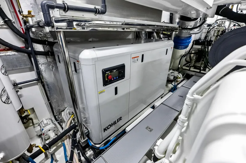 Slide: The Image of Engine room of 2024 Ocean Alexander 35 Revolution yacht featuring Kohler generator. - 68