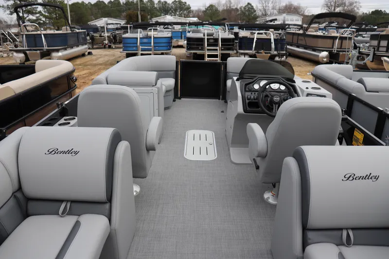 Slide: The Image of 2026 Bentley Pontoons Legacy 223 Navigator interior with luxurious seating and modern dashboard. - 10