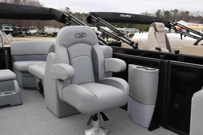 Slide: The Image of 2026 Bentley Pontoons Legacy 223 Navigator interior with luxurious seating and cup holders. - 6