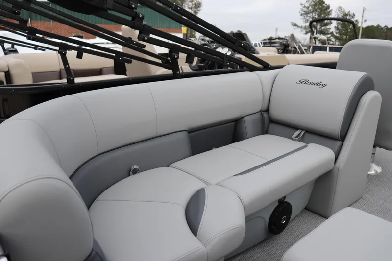 Slide: The Image of 2026 Bentley Pontoons Legacy 223 Navigator interior with luxurious gray seating. - 9