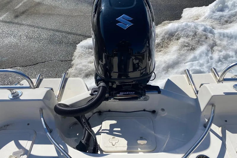 Slide: The Image of 2022 Pioneer 202 Sportfish boat with Suzuki outboard motor on water. - 12