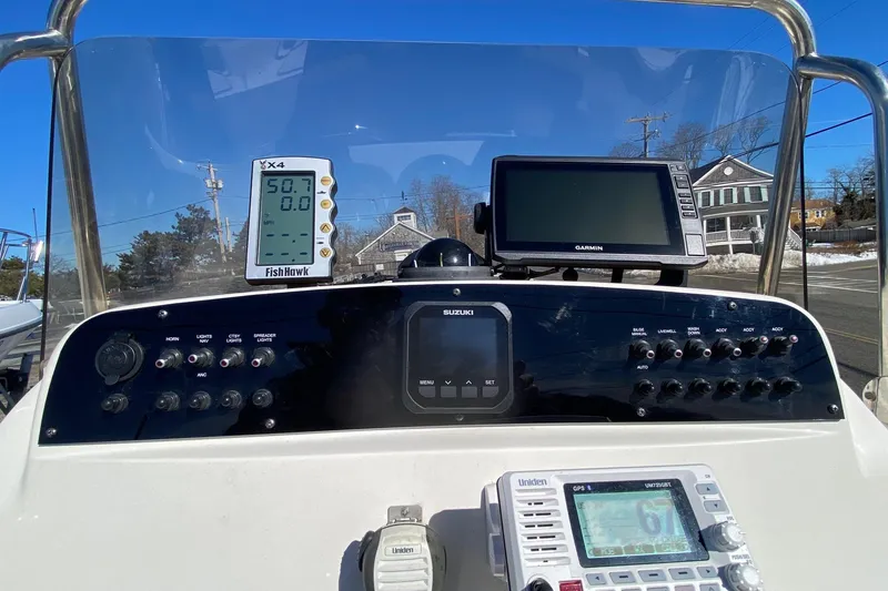 Slide: The Image of Control panel of a 2022 Pioneer 202 Sportfish boat with navigation and communication devices. - 9
