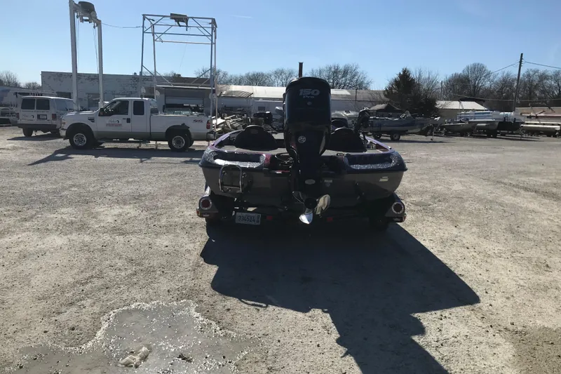 Slide: The Image of 2016 Ranger Z118 Comanche boat with outboard motor in a boatyard. - 17