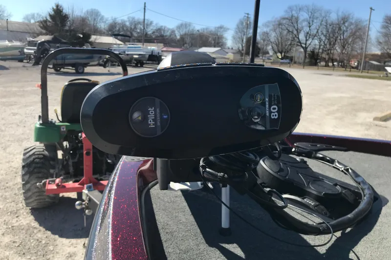 Slide: The Image of 2016 Ranger Z118 Comanche with iPilot trolling motor in a parking lot. - 23