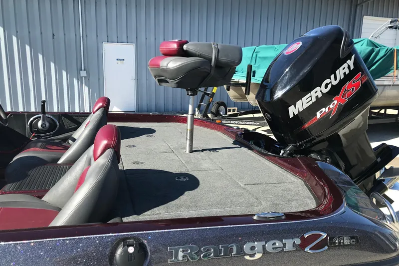 Slide: The Image of 2016 Ranger Z118 Comanche boat with Mercury Pro XS engine, featuring red and gray seating. - 26