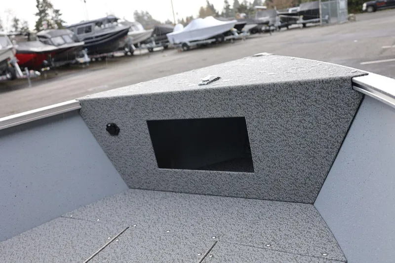 Slide: The Image of 2026 Lund 1600 Fury Tiller boat interior, featuring a textured storage compartment. - 20