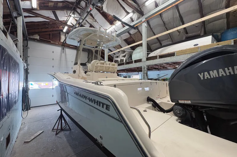 Slide: The Image of 2022 Grady-White Fisherman 236 boat in a garage with Yamaha engine. - 6