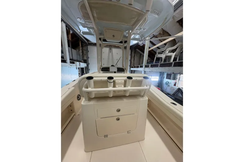 Slide: The Image of 2022 Grady-White Fisherman 236 boat interior with rod holders and storage compartments. - 8