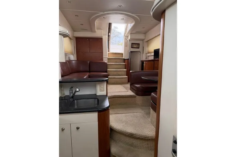 Slide: The Image of Interior of 2000 Maxum 4100 SCA yacht with elegant seating and modern design. - 39