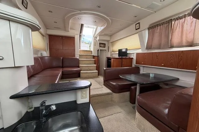 Slide: The Image of Luxurious interior of 2000 Maxum 4100 SCA yacht with leather seating and modern amenities. - 40