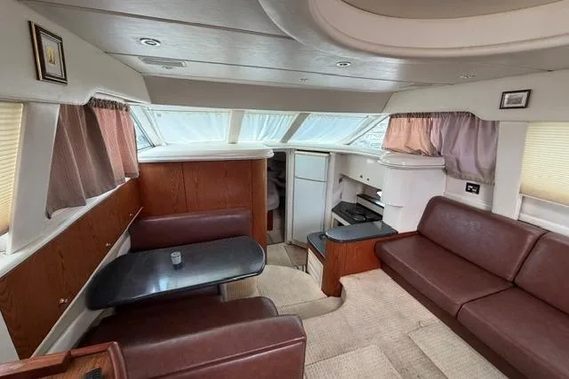 Slide: The Image of Interior of 2000 Maxum 4100 SCA yacht with leather seating and modern amenities. - 43
