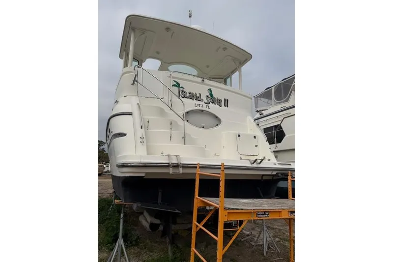 Slide: The Image of 2000 Maxum 4100 SCA yacht on dry dock, rear view with scaffolding. - 9