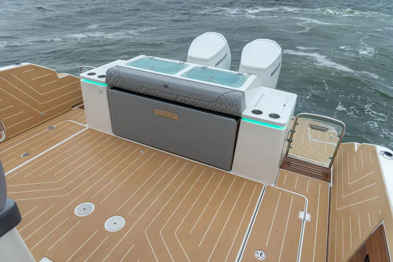 Slide: The Image of Manufacturer Provided Image: 2026 Regal LX43 boat deck with twin engines and sleek design on open water. - 14