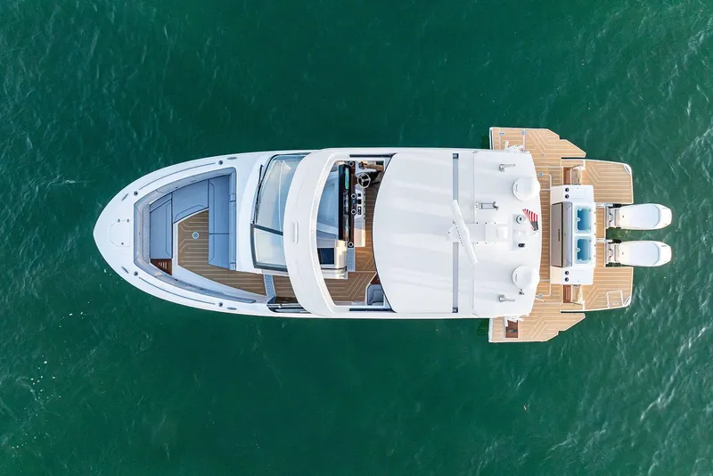 Slide: The Image of Manufacturer Provided Image: Aerial view of 2026 Regal LX43 yacht on clear blue water. - 4