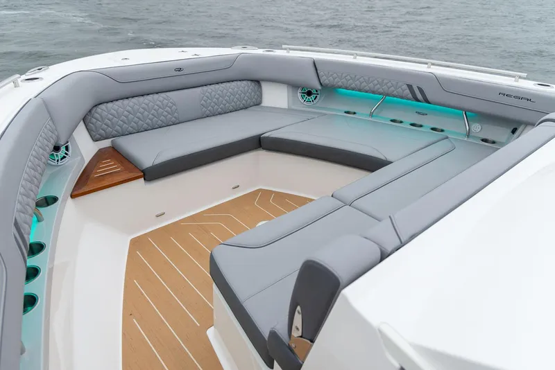 Slide: The Image of Manufacturer Provided Image: Luxurious seating area on 2026 Regal LX43 boat with elegant gray upholstery. - 5