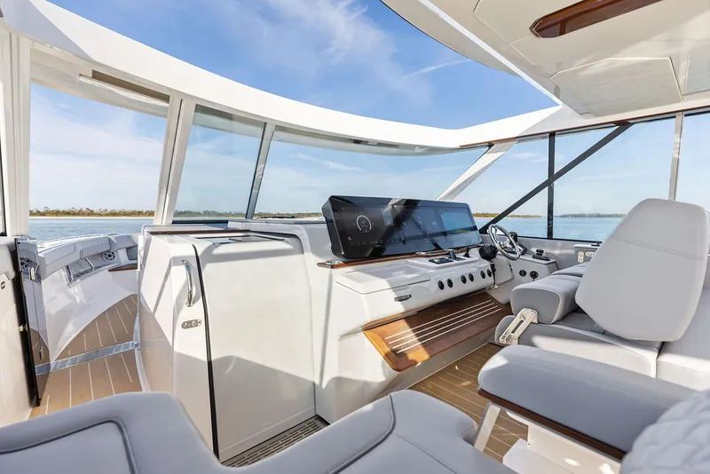 Slide: The Image of Manufacturer Provided Image: Luxurious interior of 2026 Regal LX43 yacht with modern helm and panoramic windows. - 7