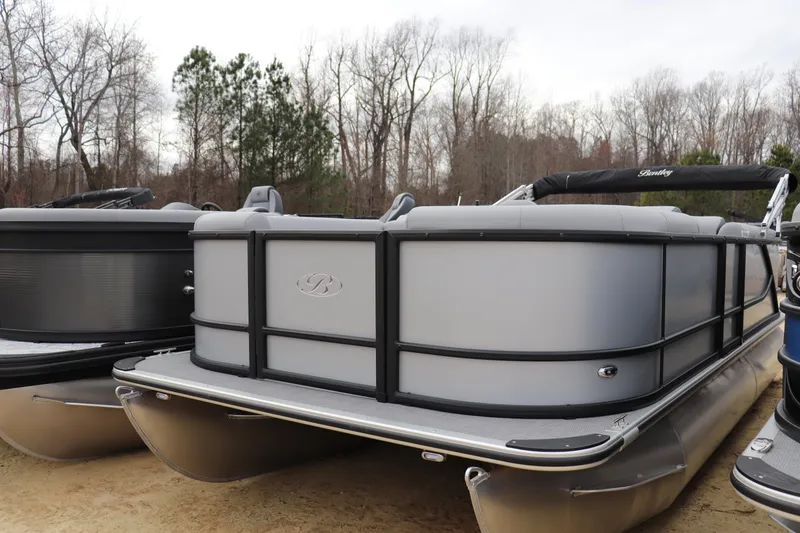 The Image of 2026 Bentley Pontoons LE 200 CW, sleek design, parked outdoors, surrounded by trees. - 0
