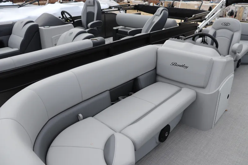 Slide: The Image of 2026 Bentley Pontoons LE 200 CW with luxurious gray seating and modern design. - 2