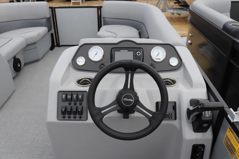 Slide: The Image of 2026 Bentley Pontoons LE 200 CW dashboard with steering wheel and control panel. - 5