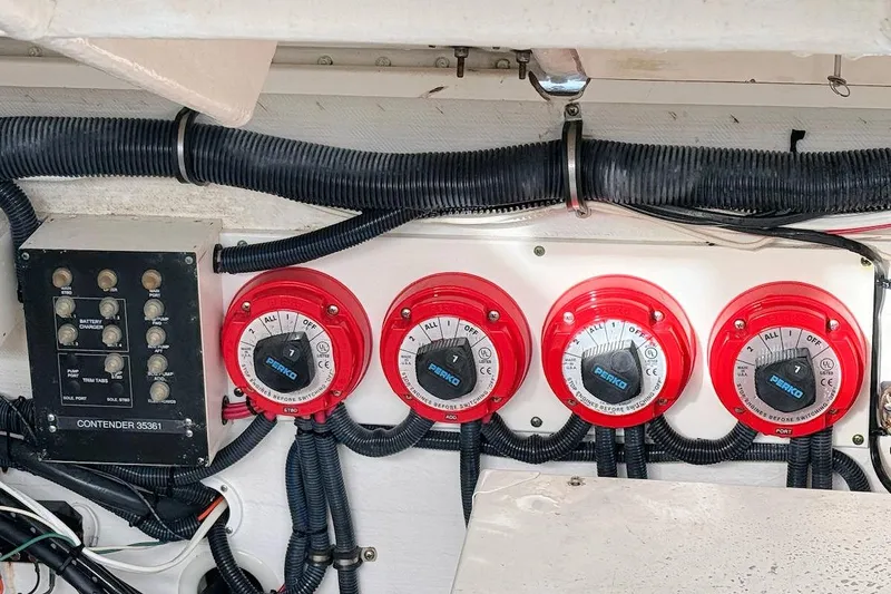 Slide: The Image of Electrical panel and switches on a 2005 Contender 35 Express Side Console boat. - 19