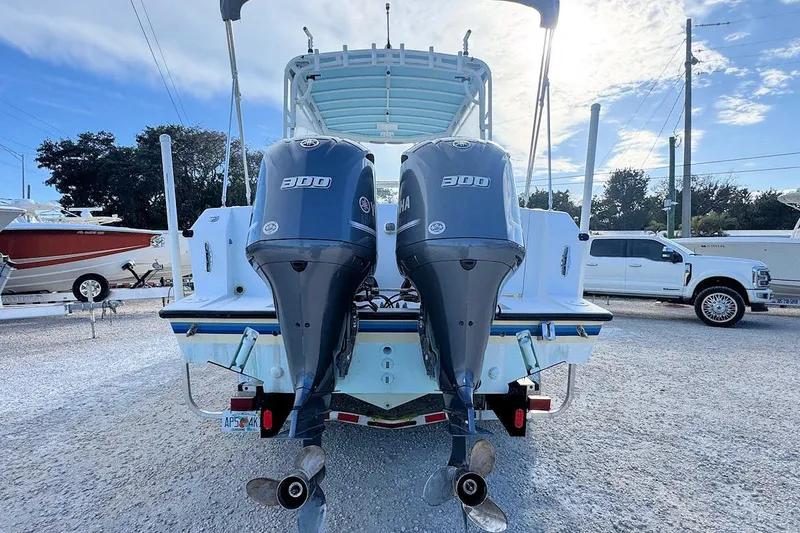 Slide: The Image of 2005 Contender 35 Express Side Console with dual Yamaha 300 engines, rear view. - 2