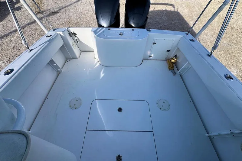 Slide: The Image of 2005 Contender 35 Express Side Console boat interior, featuring spacious deck and seating. - 6