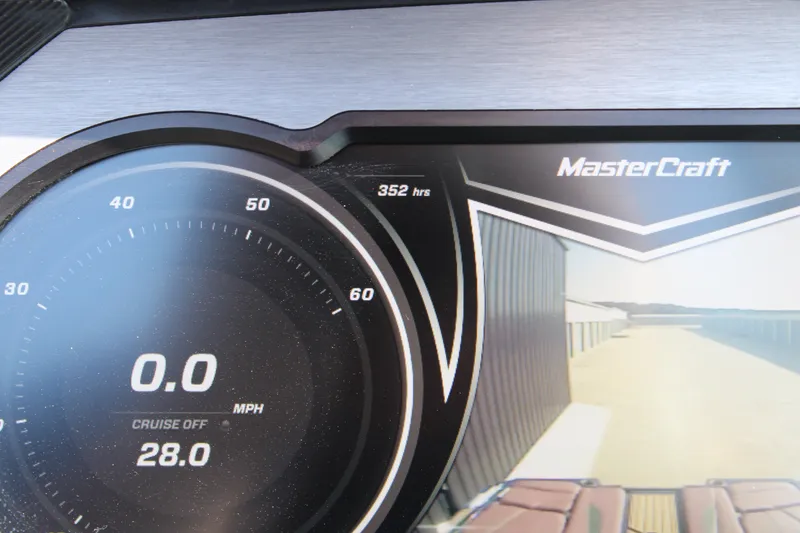 Slide: The Image of Dashboard of 2021 MasterCraft XStar showing 0.0 MPH and 352 hours. - 6