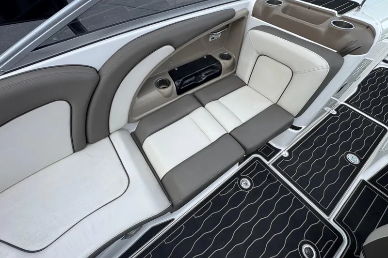 Slide: The Image of 2012 Yamaha Boats 242 Limited S interior seating with cup holders and stylish flooring. - 11