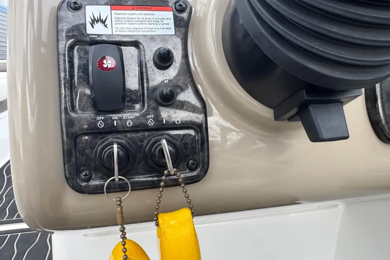 Slide: The Image of Control panel of a 2012 Yamaha Boats 242 Limited S with ignition keys. - 12