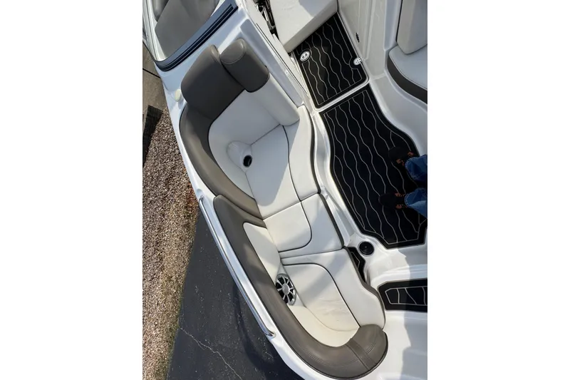 Slide: The Image of 2012 Yamaha Boats 242 Limited S interior seating with gray and white upholstery. - 16