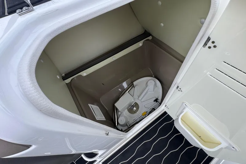 Slide: The Image of Storage compartment in 2012 Yamaha Boats 242 Limited S, featuring a clean, organized interior. - 17