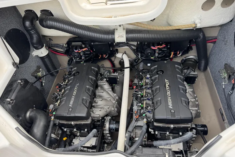 Slide: The Image of Engine compartment of 2012 Yamaha Boats 242 Limited S, featuring dual high-output engines. - 19