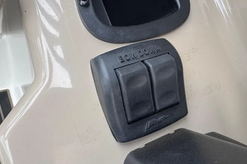 Slide: The Image of Control panel on a 2012 Yamaha Boats 242 Limited S, featuring "Bow Down" switches. - 22