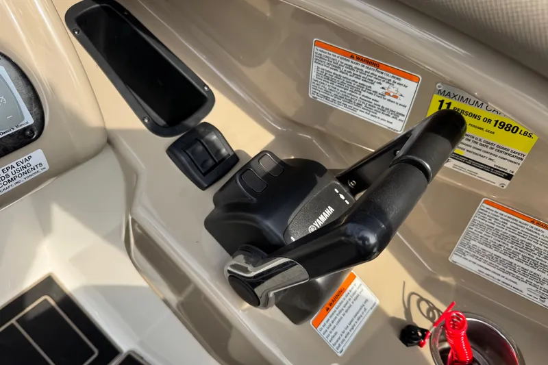 Slide: The Image of Yamaha Boats 2012 242 Limited S throttle control with safety warnings and capacity label. - 23