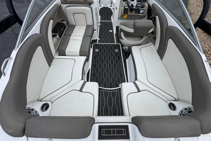 Slide: The Image of 2012 Yamaha Boats 242 Limited S interior with gray and white seating, sleek design. - 7
