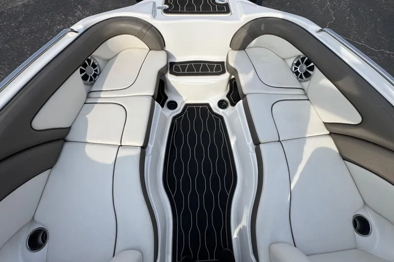 Slide: The Image of Interior of 2012 Yamaha Boats 242 Limited S, featuring white seating and black flooring. - 8
