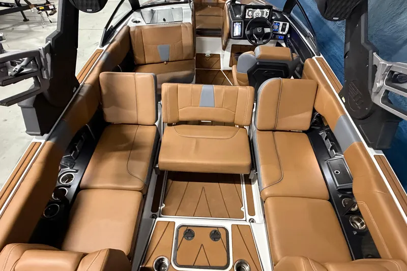 Slide: The Image of 2023 Malibu Wakesetter 23 LSV interior with tan leather seating and modern dashboard. - 15