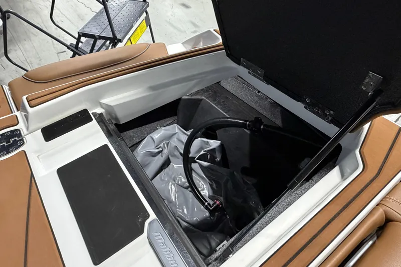 Slide: The Image of 2023 Malibu Wakesetter 23 LSV storage compartment with open lid and interior view. - 18