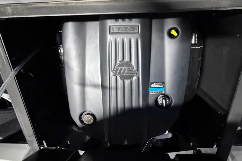 Slide: The Image of Engine compartment of 2023 Malibu Wakesetter 23 LSV boat, featuring a robust engine cover. - 20