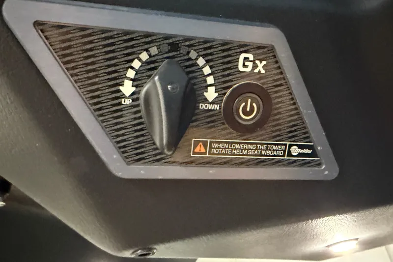 Slide: The Image of Control panel of 2023 Malibu Wakesetter 23 LSV with adjustment knob and power button. - 24