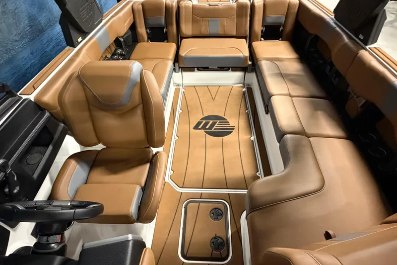 Slide: The Image of 2023 Malibu Wakesetter 23 LSV interior with luxurious brown leather seating. - 9