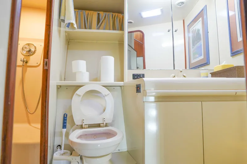 Slide: The Image of Bathroom interior of 1991 Viking 65 Cockpit yacht with shower, toilet, and sink. - 28