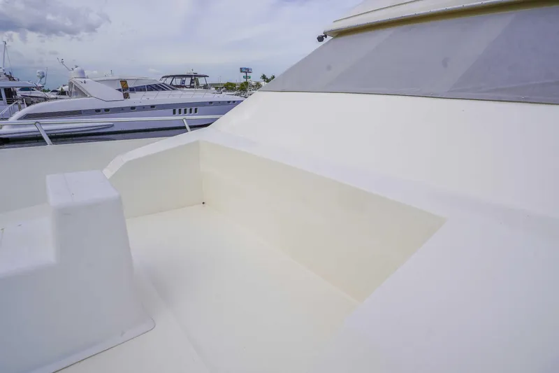 Slide: The Image of 1991 Viking 65 Cockpit yacht with spacious deck area, docked at marina. - 36
