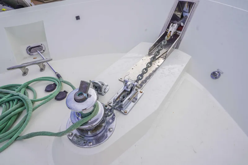 Slide: The Image of Anchor chain and winch on 1991 Viking 65 Cockpit boat deck. - 38