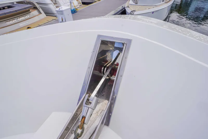 Slide: The Image of Bow detail of a 1991 Viking 65 Cockpit yacht at a marina. - 39