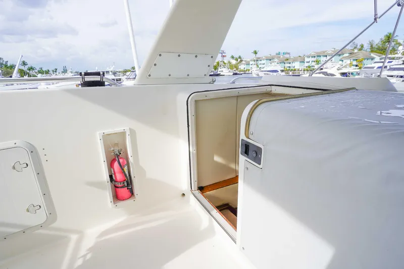 Slide: The Image of 1991 Viking 65 Cockpit yacht interior with fire extinguisher and open hatch. - 41