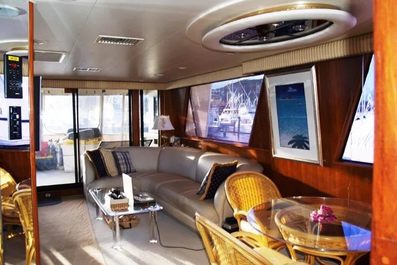 Slide: The Image of Luxurious interior of a 1991 Viking 65 Cockpit yacht with elegant seating and decor. - 5